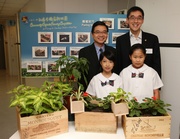 Photo 4/5:  The Jockey Club's Executive Director, Charities, Douglas So (back row right), General Secretary of Hong Chi Association Aldan Kwok (back row left) pictured with two students from St Paul Convent School (Primary Section), Jenny Ng (front row left) and Tiffany Law (front row right). The students will take part in the Hong Kong Jockey Club Community Organic Farming Competition for Primary and Secondary Schools.