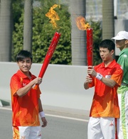 Apprentice Jockey!|s Derek Leung (right) and Keith Yeung are honoured to be Club torchbearers.
