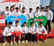 Club apprentice jockeys (front row, from left) Derek Leung, Keith Yeung, Ben So and Vincent Ho and trainees (front row, right) form a team to compete with the Elite Athletes Team in a multi-sports game this afternoon.