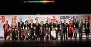 Pictured with guests and young people at the opening ceremony are the Hong Kong Jockey Club's Chief Executive Officer Winfried Engelbrecht-Bresges (back row, 2nd from left); Financial Secretary John Tsang (back row, 3rd from left); and Chief Executive of the Hong Kong Institute of Contemporary Culture, Ada Wong (back row, 1st from left).