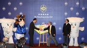 Photos 3/4/5: Club Chairman John C C Chan presents a giant gift to Secretary for Home Affairs Tsang Tak-sing, representing Club's donation of HK$40 million to support the Hong Kong 2009 East Asian Games, with Chairman of the 5th East Asian Games Planning Committee Timothy Fok, HKJC Mascot and Mascots of the Hong Kong 2009 East Asian Games Ami and Dony as witnesses of the ceremony. 

