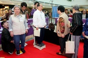 Photos 6/7/8 Members of the public learn how to measure their body mass index (BMI).