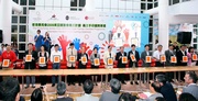 Club Deputy Chairman T Brian Stevenson (7th from right) joins guests and representatives from the nine East Asian Games participating countries and regions to add their imprints to the Volunteer Handprint Wall.