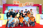 The Hong Kong Jockey Club's Executive Director, Charities, William Y Yiu (back row, 3rd from right) pictured with Tai Keen Man, Assistant Director (Radio) of RTHK (back row, 4th from left); Dr Bernard Kong, President of The Hong Kong Geriatrics Society (back row, 2nd from left); Tse Shu To, Assistant District Social Welfare Officer (Tsuen Wan/Kwai Tsing) of Social Welfare Department, (back row, 1st from right); the Club's Head of Charities Bonny Wong (back row, 4th from right)and guest artistes.