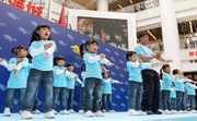 A demonstration of the ten Can Do Exercise routines performed by a group of kindergarten pupils and other community members receives an enthusiastic response from the audience.

