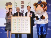 The Club's Executive Director of Corporate Development Kim Mak (right) presents a set of the 20 ticket designs used for last November's 125th Anniversary Sweepstakes to Chairman of Kwai Tsing District Council Tang Kwok-kong (middle) and Assistant District Officer of Kwai Tsing District Fabia Tam (left).