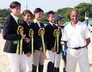 KGV Team 1, led by HKJC Junior Equestrian Team member Patricia Chan (3rd from left), claims the third place in the team competition of the Inter-school Equestrian Challenge.