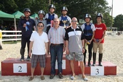 Club Director of Racing Operations John Ridley (first row, centre) and trainers, Almond Lee (first row, left) and Andreas Schutz (first row, right) join in the prize presentation for the horseback fun race. 