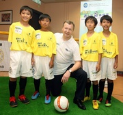 Club Chief Executive Officer Winfried Engelbrecht-Bresges and the young footballers.