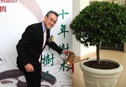 Club Steward Anthony W K Chow waters a plant, symbolising the act of sowing seeds for the future.