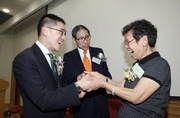 Volunteer Leung Kwai-lin (right) tells the Club's Executive Director, Charities, Legal & Corporate Secretariat, Douglas So (left) and Elderly Commission Chairman Dr Leong Che-hung (centre) that the project has enabled her to communicate more effectively with the elderly, and hence become a bridge between seniors and social workers.
