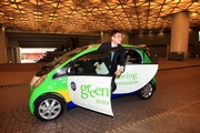 The Club's Executive Director, Charities, Douglas So arrives at the venue by one of the Club!|s electric cars.