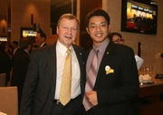 Hong Kong Jockey Club Chief Executive Officer Winfried Engelbrecht-Bresges (left) pictured with scholar Eric Chen from City University of Hong Kong.  Eric and some of his classmates founded a company to enhance food safety by using genetically-modified fish.