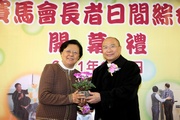 Caritas !V Hong Kong Chief Executive The Rev Michael Yeung (right) presents souvenir to Jockey Club Steward Dr Rita Fan Hsu Lai Tai (left).