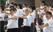 Photos 5, 6 & 7: Around 1,000 district representatives, Racing Trainees, members of the Club's CARE@hkjc Volunteer Team and the Hong Kong Wing Chun Union take the lead in performing a mass demonstration of the 'Hong Kong Can Do Exercise'.