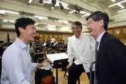 The Hong Kong Jockey Club's Executive Director, Charities, William Y Yiu shows support to Artistic Director and Principal Conductor of the Hong Kong Chinese Orchestra, Yan Huichang (centre), renowned cellist Trey Lee (left) and the Orchestra.