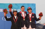 Photo 1 & 2 The Hong Kong Jockey Club Equestrian Team member Patrick Lam (Photo 1: middle / Photo 2: left) won the individual gold medal in the Jumping competition of the 11th National Games of the People!|s Republic of China while another team member Kenneth Cheng (Photo 1 & 2: right) also won the bronze medal in the same event. 
