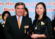 Hong Kong Jockey Club Deputy Chairman T Brian Stevenson presents graduation pins to the Scholars.