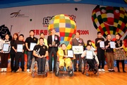 The Club's Executive Director of Charities, William Y Yiu (back row, 6th from left), Secretary for Labour and Welfare Matthew Cheung (back row, 5th from right) and representatives of nine rehabilitation organisations at the opening ceremony of the Annual Performance.