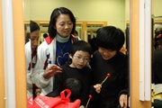 Photos 8/9: The Club's CARE@hkjc Volunteer Team members offer their assistance to the Jockey Club Arts for the Disabled Scheme Annual Performance 2009 to promote harmony and integration between disabled and able-bodied people.