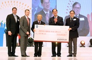 (From left) Chairman of The Hong Kong Jockey Club Dr John C C Chan (centre) presents a HK$10 million cheque today to Chairman of the 5th East Asian Games Planning Committee Timothy Fok (1st from right), witnessed by Secretary for Home Affairs Tsang Tak-sing and accompanied by Chief Executive Officer of The Hong Kong Jockey Club Winfried Engelbrecht-Bresges (2nd from left) and Executive Director, Racing, William A Nader (1st from left). 