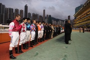 Jockeys and trainers attend the one-minute silence ceremony.