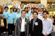 The Club!|s Executive Director, Charities, Legal & Corporate Secretariat, Douglas So (1st row left); Chairman of Yau Tsim Mong District Council, Chung Kong-mo (1st row centre); and Assistant District Officer (Yau Tsim Mong), Chiu Man-hin (1st row right) pictured with the Hong Kong Can Do Exercise performing group, who include members of the Club!|s CARE@hkjc Volunteer Team and representatives from Friends of Yaumatei & Tsimshatsui Society and Friends of Tai Kok Tsui.

