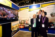 Club Chairman Dr John C C Chan (left), Executive Director, Charities, Legal & Corporate Secretariat, Douglas So (centre) and 2010 Joint World Conference Organising Committee Chairperson Christine Fang (right) visit The Hong Kong Jockey Club!|s exhibition booth.