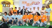 The Club!|s Executive Director, Charities, Legal & Corporate Secretariat, Douglas So (back row, 4th from left) is pictured with Lo Wing-man, Member of Sham Shui Po District Council (back row, 5th from left); Dr Mong Hoi-keung, Road Safety Council Member and Chairman of the Institute of Advanced Motorists Hong Kong (back row, 3rd from left); Yeung Pui-yee, Occupational Therapist of The Chinese University of Hong Kong (back row, 2nd from right); Tai Keen Man, Assistant Director (Radio) of RTHK (back row, 4th from right); Ip Sai Hung, Head of RTHK Radio 5 (back row, 3rd from right); and guest artistes.