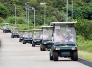 Guests take a ride in the solar golf carts.